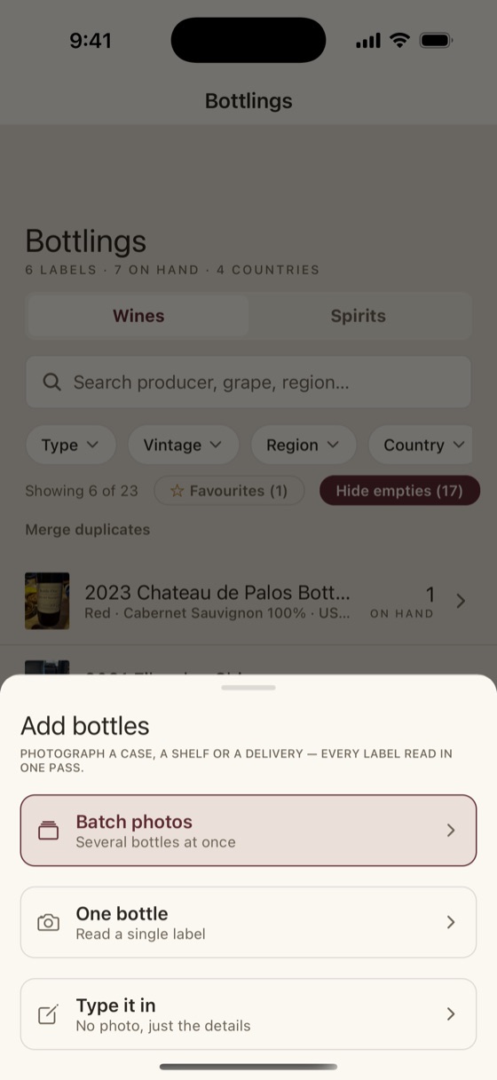 The add-bottles sheet offering batch photos for several bottles at once, a single label read, or typing the details in by hand